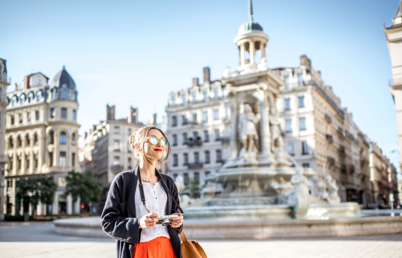 Traveller exploring a grand European city square on a Trafalgar guided holiday