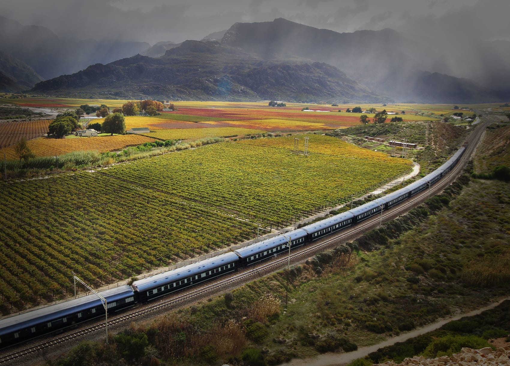 Train Traveling with Mountains