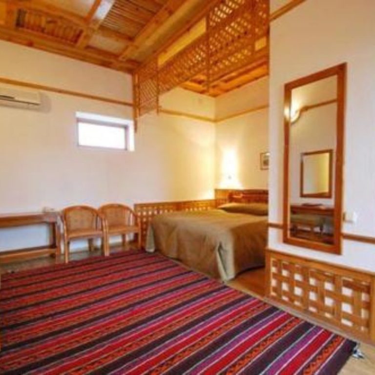 A cozy room at Khanqah Hotel
