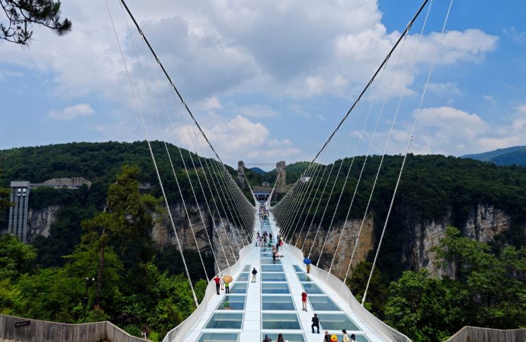 glass bridge over river.