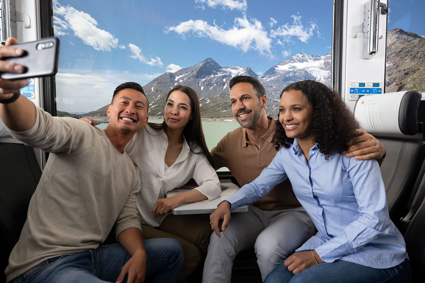 Panoramic carriage of the Bernina Express with views over Lago Bianco